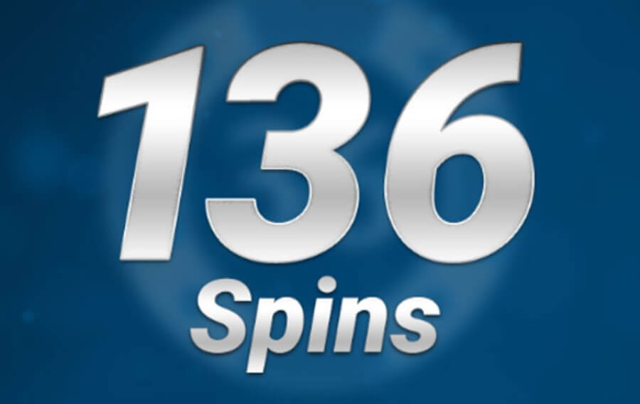 A promotional casino bonus graphic displaying large 3D metallic silver text reading "136 Spins" centered on a dark blue radial gradient background.
