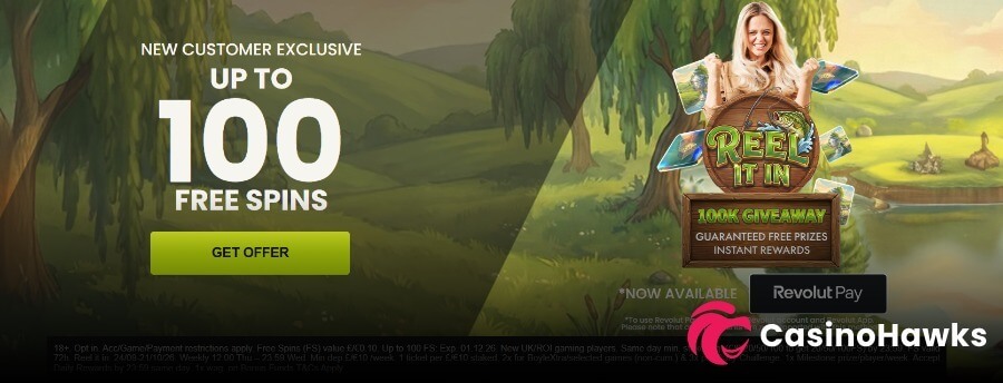 BoyleSports Casino promotional hero banner set against a scenic countryside lake background with weeping willow trees. The left side displays white and green bold text reading "NEW CUSTOMER EXCLUSIVE UP TO 100 FREE SPINS" with a lime green "GET OFFER" button. The right side features a smiling female host holding slot cards beside the Reel It In game logo and a wooden plaque reading "100K GIVEAWAY GUARANTEED FREE PRIZES INSTANT REWARDS". A badge displays "Revolut Pay NOW AVAILABLE" alongside a CasinoHawks watermark and bottom UKGC compliance fine print (18+, Opt in, App/Game/Payment restrictions apply, Free Spins FS value £/€0.10, Exp 31.12.26, New UK/ROI players).