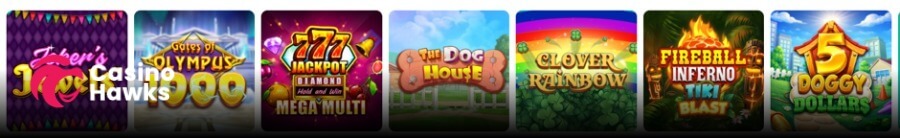 A horizontal online casino slot game row displaying seven square game thumbnails on a dark interface. From left to right, the tiles feature Joker's Jewels alongside the Casino Hawks pink lion logo, Pragmatic Play's Gates of Olympus 1000, 777 Jackpot Diamond Hold and Win Mega Multi, Pragmatic Play's The Dog House, Clover Rainbow, Fireball Inferno Tiki Blast, and 5 Doggy Dollars.