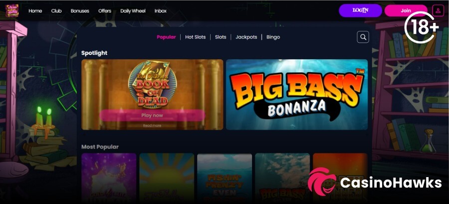 A dark magic-themed desktop interface screenshot of the Wizard Slots homepage lobby. The top navigation header displays white links for Home, Club, Bonuses, Offers, Daily Wheel, and Inbox, alongside purple LOGIN and pink Join buttons, and an 18+ age verification badge in the top right. Category tabs include Popular, Hot Slots, Slots, Jackpots, and Bingo. The main Spotlight section features prominent banners for Play'n GO's Rich Wilde and the Book of Dead with a pink "Play now" button and Reel Kingdom's Big Bass Bonanza. The lower Most Popular row showcases tiles including Gold Blitz Ultimate, Starburst, Blueprint's Fishin' Frenzy Even Bigger Catch, and Big Bass Splash, with the Casino Hawks pink lion co-branding logo in the bottom right corner.