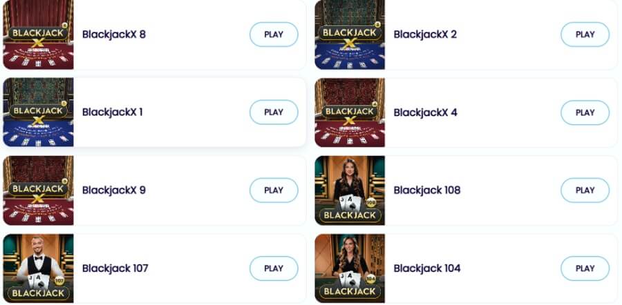 An online casino live dealer lobby menu listing eight live blackjack table choices arranged in two vertical columns on a white background. The layout features Pragmatic Play live table cards with individual "PLAY" buttons. Featured tables include BlackjackX 8, BlackjackX 2, BlackjackX 1, BlackjackX 4, and BlackjackX 9 showing stylized table felt graphics, alongside classic live dealer tables featuring real croupier thumbnails including Blackjack 108, Blackjack 107, and Blackjack 104.