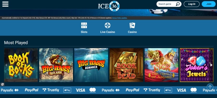 Desktop homepage layout for ICE 36 Casino displaying the brand logo, search bar, and primary navigation icons for Slots, Live Casino, and Casino. A top promotional disclosure banner states deposit terms ("Automatically credited on 1st Deposit (min £10)..."). The central "Most Played" games row showcases six popular slot tiles: Book of Books, Big Bass Splash, Big Bass Bonanza, Rich Wilde and the Book of Dead, Thor The Trials of Asgard, and Joker's Jewels. The bottom footer highlights accepted UK payment methods including Paysafe, PayPal, Trustly, Apple Pay, Visa, and Mastercard.