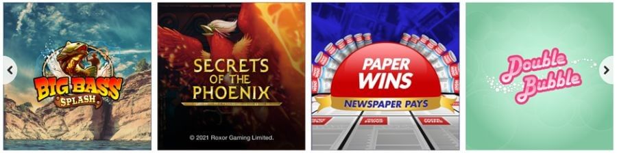 A horizontal row of four online slot game selection tiles showcased on a digital casino platform. The featured game titles include Big Bass Splash by Reel Kingdom/Pragmatic Play, Secrets of the Phoenix featuring a prominent red firebird asset by Roxor Gaming, Paper Wins: Newspaper Pays featuring retro red-top news print themes, and the classic pink branding for Double Bubble. This targets localized UK search intent for "Jackpotjoy slot games list," "play Secrets of the Phoenix online real money," and "best sites for Double Bubble slots."