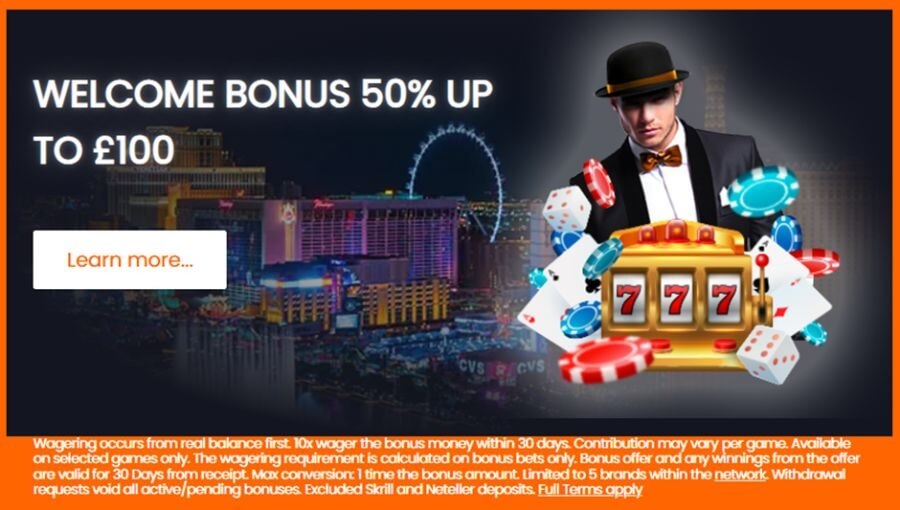 Online casino welcome bonus banner: "Welcome Bonus 500% Up To £100" with an orange "Learn more" button. The visual shows a croupier in a tuxedo and bowler hat alongside a 777 slot machine, dice, cards, and casino chips with a Las Vegas night skyline in the background. This targets search intent for "best casino welcome bonus UK," "low wagering deposit match," and "real money slots sign up offers."