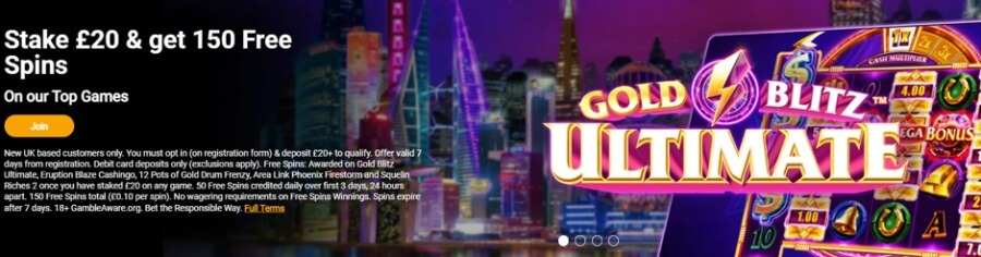 An online casino promotional welcome banner set against a purple neon city skyline background at night. Bold white text reads "Stake £20 & get 150 Free Spins" subheaded with "On our Top Games" directly above an orange "Join" button. The right side features a tablet display showcasing the slot game Gold Blitz Ultimate with its gold and lightning bolt logo, cash multipliers, and jackpot reels. Fine print T&Cs at the bottom state an offer for new UK based customers only who opt in, deposit £20+, and receive 150 free spins (£0.10 per spin, 50 daily over 3 days) valid on Gold Blitz Ultimate, Eruption Blaze Cashingo, 12 Pots of Gold Drum Frenzy, Area Link Phoenix Firestorm, and Squelin Riches 2 with no wagering requirements on free spins winnings. Includes 18+ and GambleAware.org compliance disclaimers.