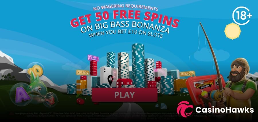 A vibrant promotional casino banner featuring an illustrated casino city made of poker chips, playing cards, and dice against a bright blue sky and snowy mountain background. Bold curved white and pink text displays "NO WAGERING REQUIREMENTS - GET 50 FREE SPINS ON BIG BASS BONANZA WHEN YOU BET £10 ON SLOTS" above a dark red "PLAY" button. On the right, Pragmatic Play's bearded fisherman character holding a fishing rod stands beside a Big Bass Bonanza tackle box. On the left, floating slot symbols display gold coins and a green fish. An 18+ age verification badge rests in the top right corner, fine-print T&Cs run along the bottom, and the Casino Hawks pink lion co-branding logo sits in the bottom right corner.